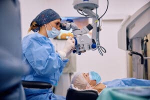 Female ophthalmologist performs surgery on elderly patients cataracts